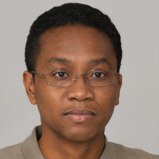 Neutral black adult male with short  brown hair and brown eyes