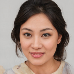 Joyful asian young-adult female with medium  brown hair and brown eyes