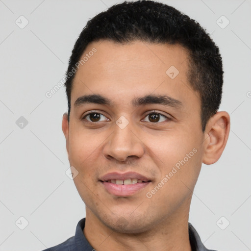 Joyful white young-adult male with short  black hair and brown eyes