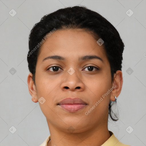 Joyful black young-adult female with short  brown hair and brown eyes