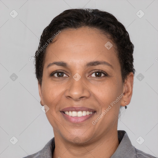 Joyful white young-adult female with short  black hair and brown eyes