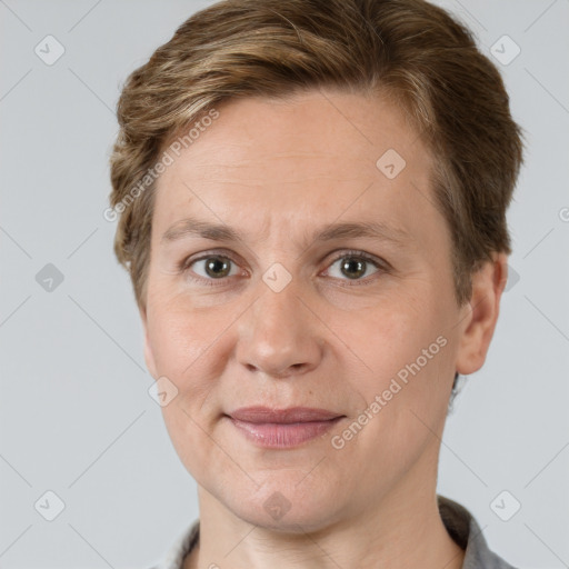 Joyful white adult female with short  brown hair and grey eyes