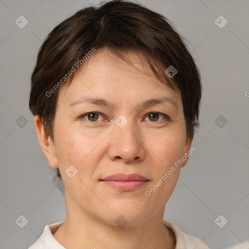 Joyful white adult female with short  brown hair and brown eyes