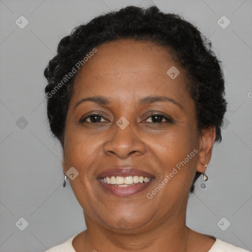 Joyful black adult female with short  brown hair and brown eyes