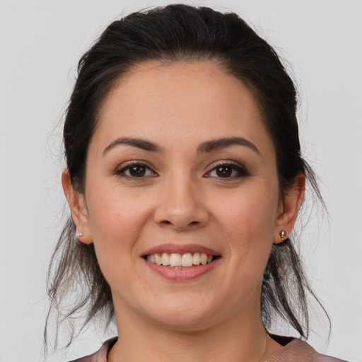 Joyful white young-adult female with medium  brown hair and brown eyes