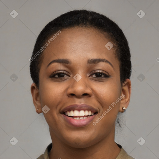 Joyful black young-adult female with short  black hair and brown eyes