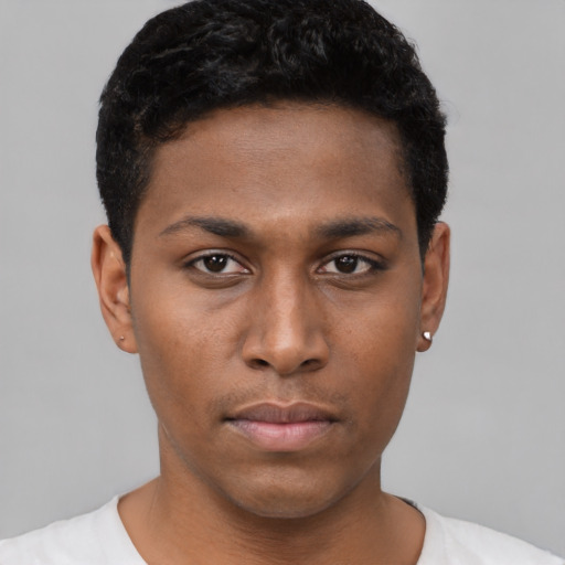 Neutral black young-adult male with short  black hair and brown eyes