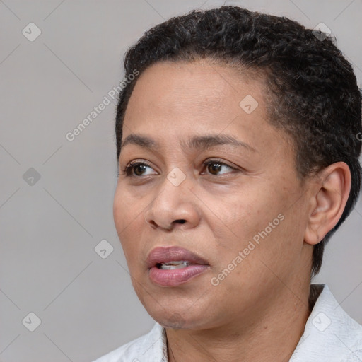 Joyful black adult female with short  brown hair and brown eyes