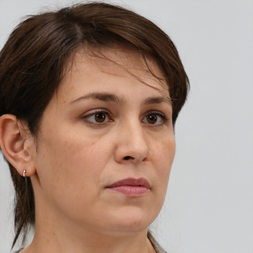 Neutral white adult female with medium  brown hair and brown eyes