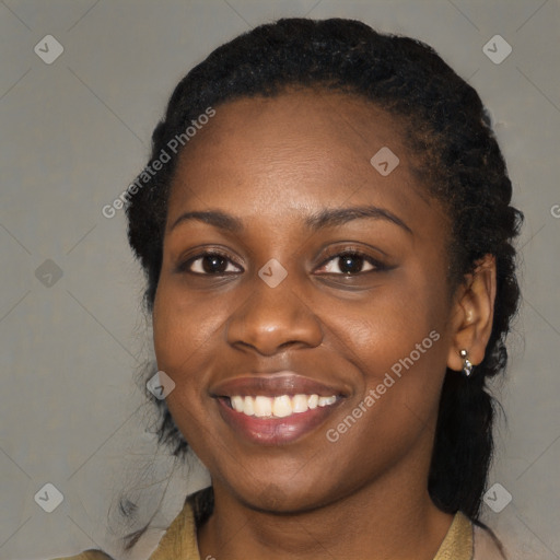 Joyful black young-adult female with medium  black hair and brown eyes