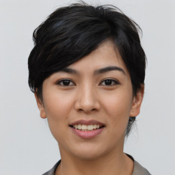 Joyful asian young-adult female with short  black hair and brown eyes