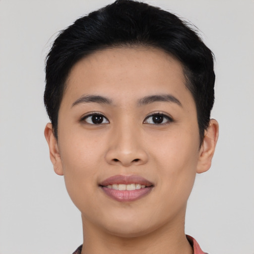 Joyful asian young-adult female with short  black hair and brown eyes