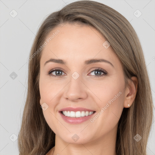 Joyful white young-adult female with long  brown hair and grey eyes