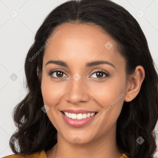 Joyful latino young-adult female with long  brown hair and brown eyes