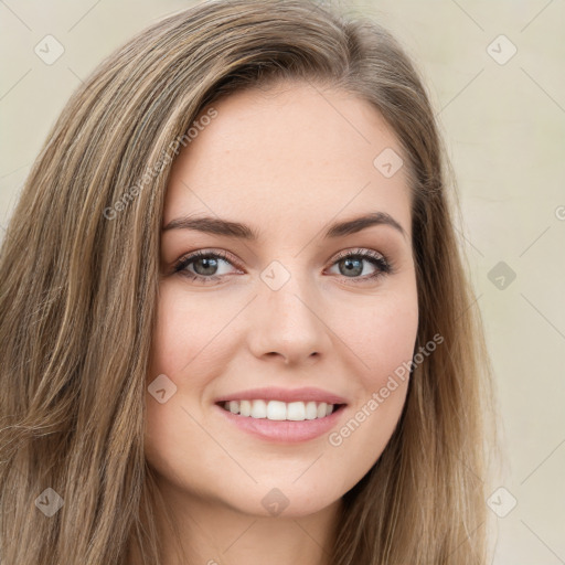 Joyful white young-adult female with long  brown hair and green eyes