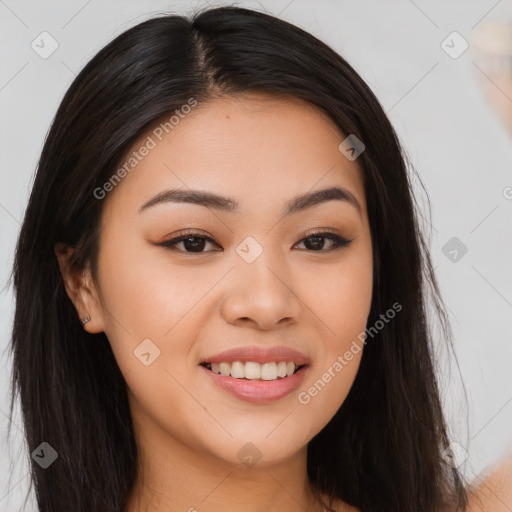 Joyful asian young-adult female with long  brown hair and brown eyes