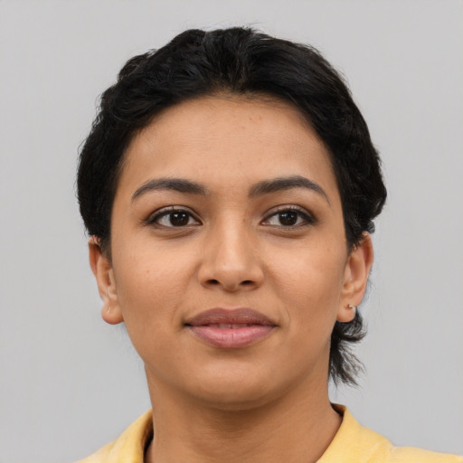 Joyful asian young-adult female with short  black hair and brown eyes
