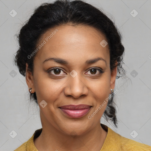 Joyful black adult female with medium  brown hair and brown eyes