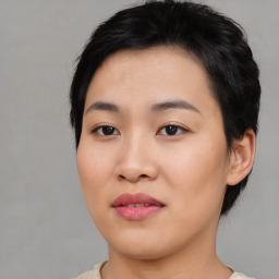 Joyful asian young-adult female with short  black hair and brown eyes