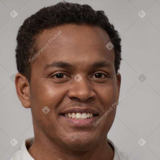 Joyful latino young-adult male with short  brown hair and brown eyes