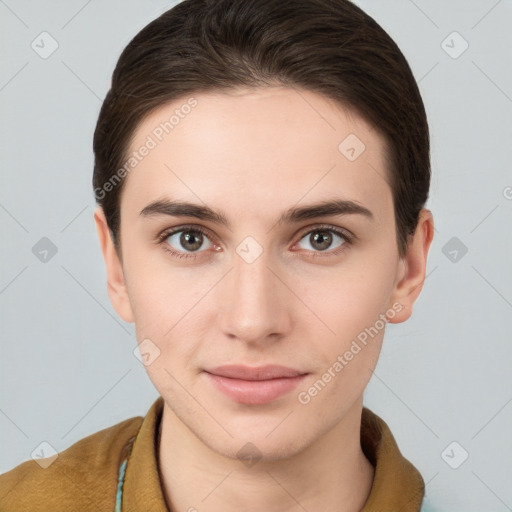 Joyful white young-adult female with short  brown hair and brown eyes