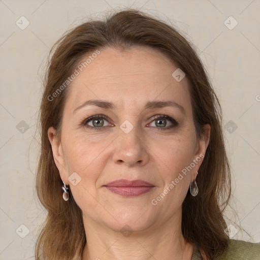 Joyful white adult female with medium  brown hair and grey eyes