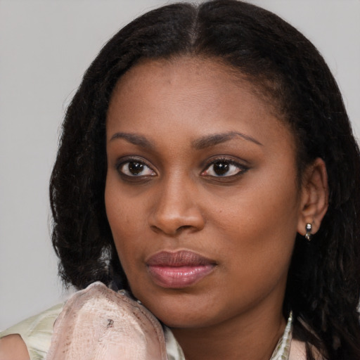 Neutral black young-adult female with medium  brown hair and brown eyes
