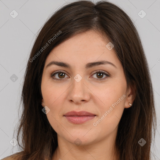 Joyful white young-adult female with long  brown hair and brown eyes