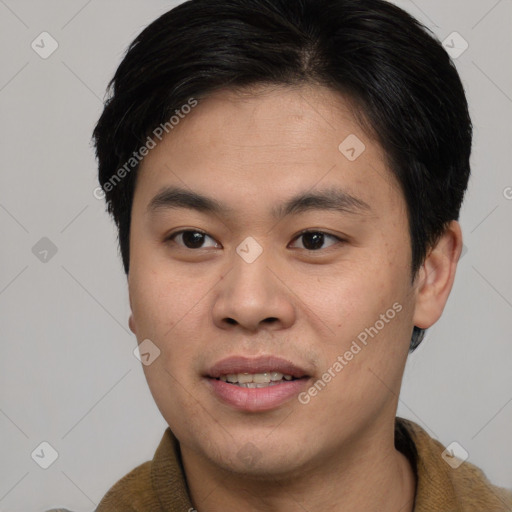 Joyful asian young-adult male with short  brown hair and brown eyes