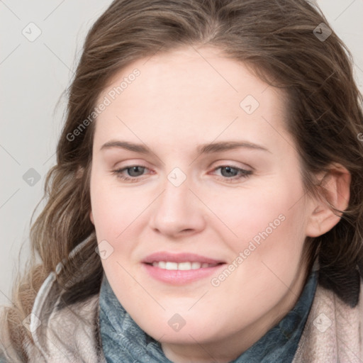 Joyful white young-adult female with medium  brown hair and blue eyes