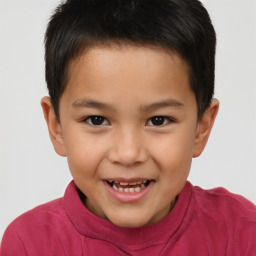 Joyful white child male with short  brown hair and brown eyes