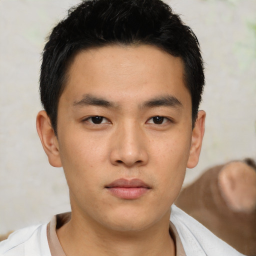 Neutral asian young-adult male with short  brown hair and brown eyes