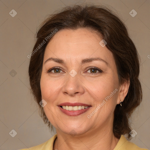 Joyful white adult female with medium  brown hair and brown eyes