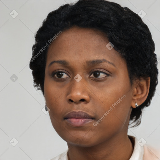 Neutral black young-adult female with short  black hair and brown eyes