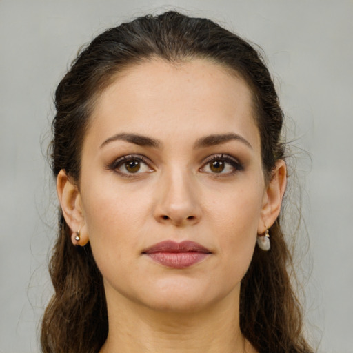 Neutral white young-adult female with medium  brown hair and brown eyes