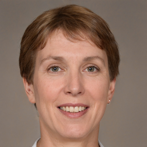 Joyful white adult female with short  brown hair and grey eyes