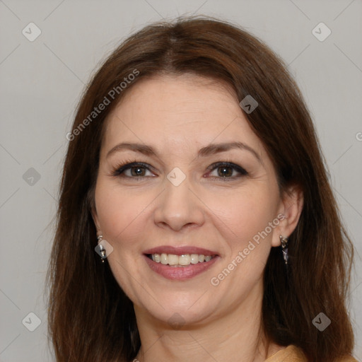 Joyful white adult female with medium  brown hair and brown eyes