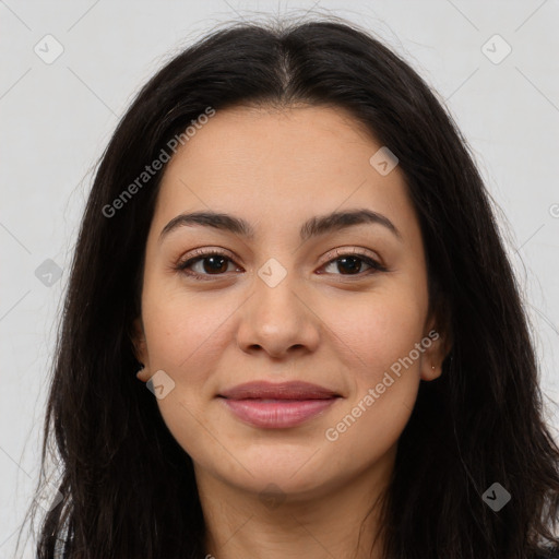 Joyful latino young-adult female with long  brown hair and brown eyes