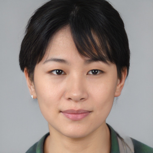 Joyful asian young-adult female with short  brown hair and brown eyes