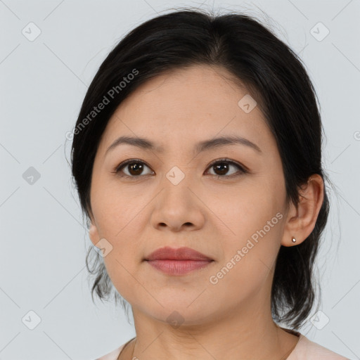 Joyful asian young-adult female with medium  brown hair and brown eyes