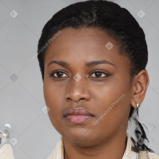 Neutral black young-adult female with short  black hair and brown eyes