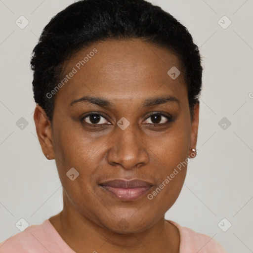 Joyful black adult female with short  black hair and brown eyes