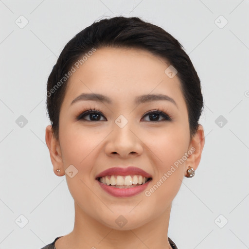 Joyful asian young-adult female with short  black hair and brown eyes