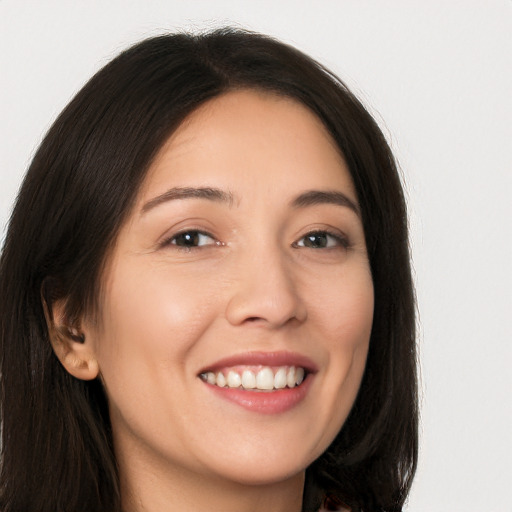 Joyful white young-adult female with long  brown hair and brown eyes