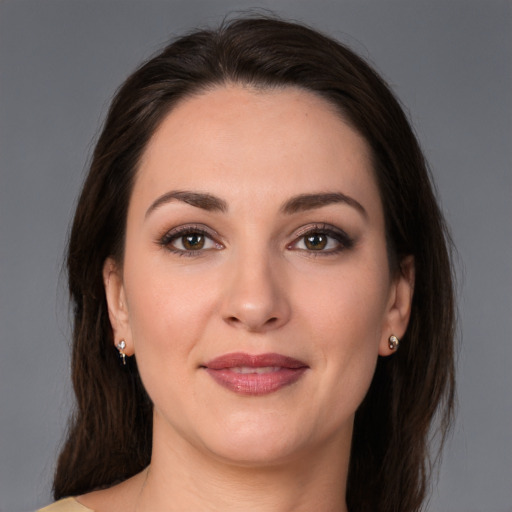 Joyful white young-adult female with medium  brown hair and brown eyes