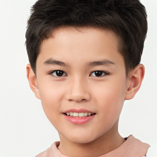 Joyful white child male with short  brown hair and brown eyes