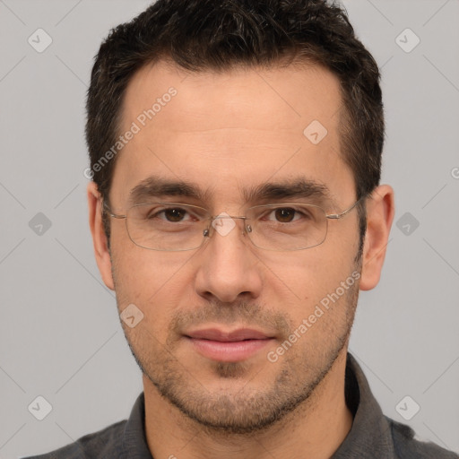 Joyful white adult male with short  brown hair and brown eyes