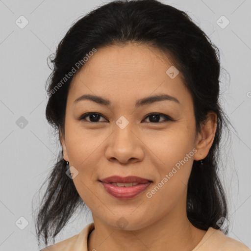 Joyful latino young-adult female with medium  brown hair and brown eyes