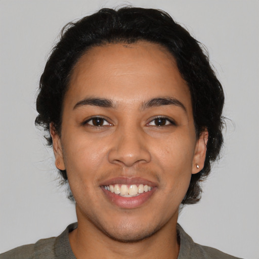 Joyful latino young-adult female with medium  black hair and brown eyes