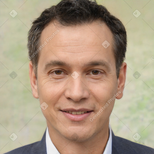 Joyful white adult male with short  brown hair and brown eyes